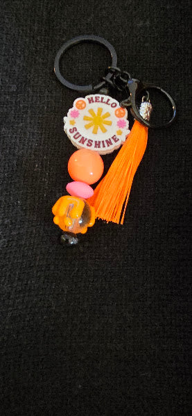 orange/pink peace sign keychain